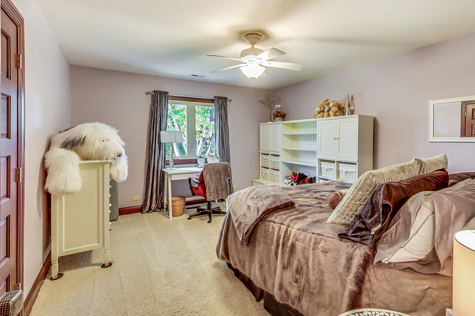 224 Perth Road Cary, IL 60013 - Photo 26 of 39 a bed room with a bed and a chandelier