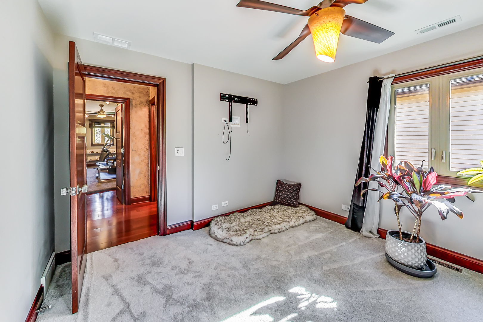 224 Perth Road Cary, IL 60013 - Photo 29 of 39 a bedroom with a bed and a chandelier