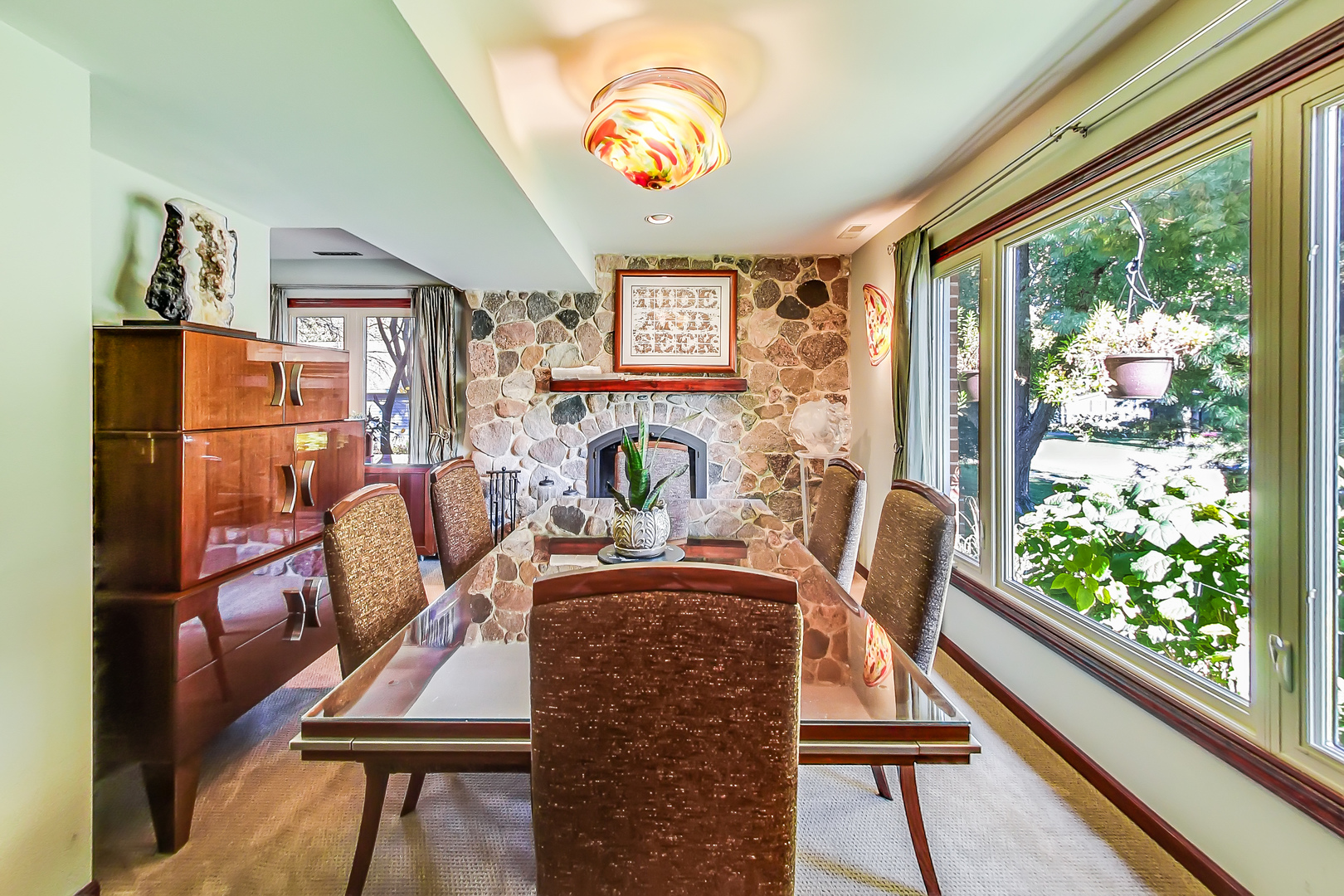 224 Perth Road Cary, IL 60013 - Photo 8 of 39 a view of a dining room with furniture a chandelier and wooden floor