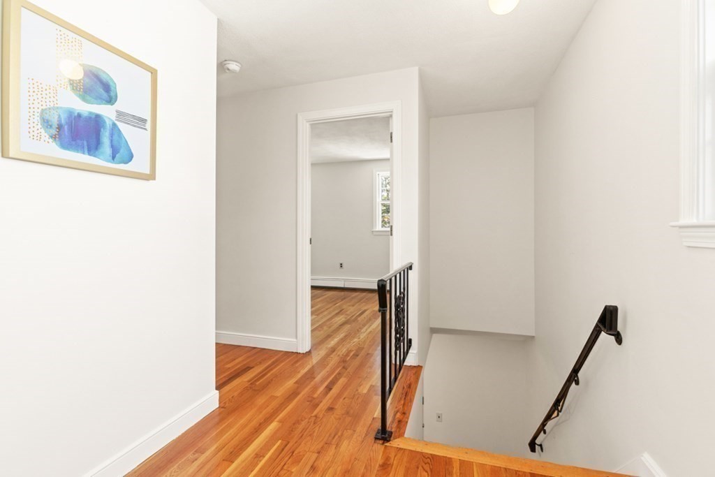68 School Street Lexington, MA 02421 - Photo 11 of 24 a view of a hallway with wooden floor