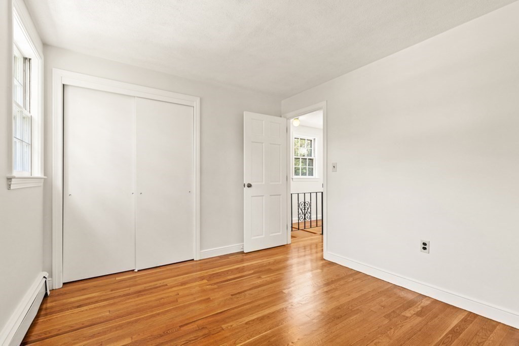 68 School Street Lexington, MA 02421 - Photo 14 of 24 a view of an empty room with wooden floor