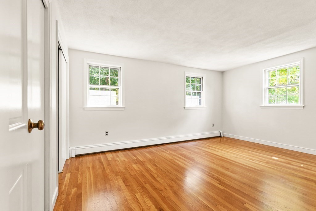 68 School Street Lexington, MA 02421 - Photo 15 of 24 a view of an empty room with wooden floor and a window