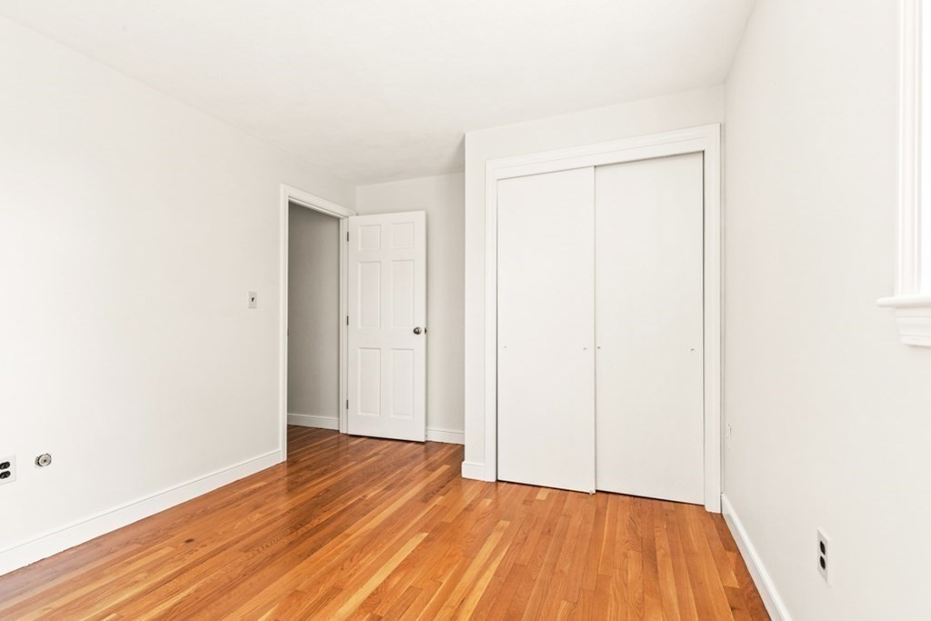 68 School Street Lexington, MA 02421 - Photo 16 of 24 a view of an empty room with wooden floor