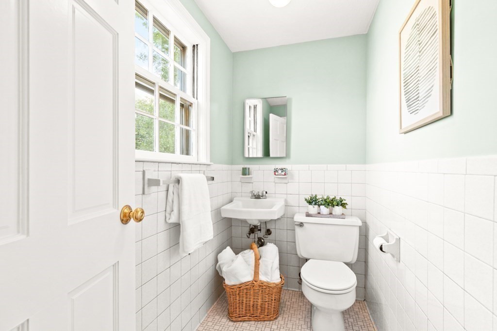 68 School Street Lexington, MA 02421 - Photo 17 of 24 a bathroom with a sink toilet and mirror