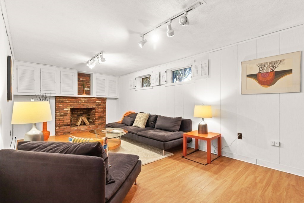 68 School Street Lexington, MA 02421 - Photo 19 of 24 a living room with furniture and a fireplace