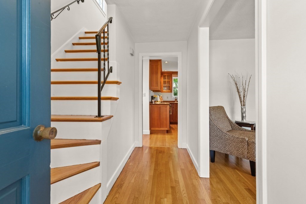 68 School Street Lexington, MA 02421 - Photo 2 of 24 a view of a hallway with wooden floor and staircase