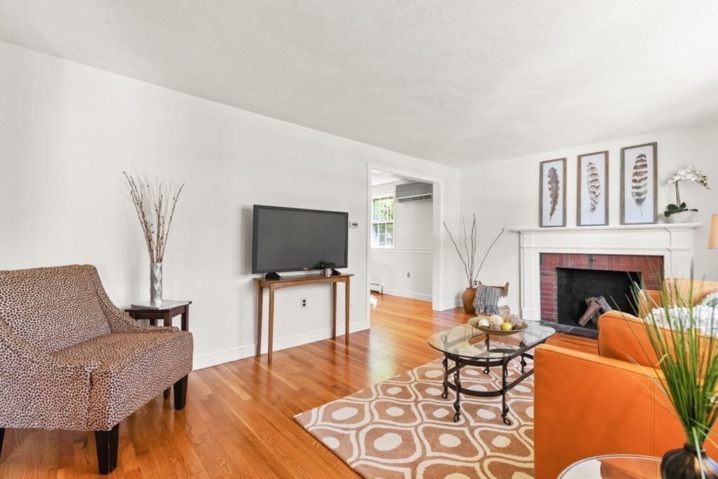 68 School Street Lexington, MA 02421 - Photo 3 of 24 a living room with furniture and a flat screen tv