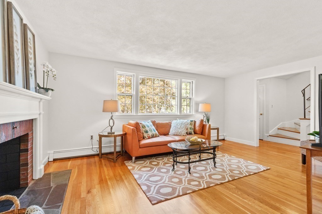 68 School Street Lexington, MA 02421 - Photo 4 of 24 a living room with furniture and a fireplace