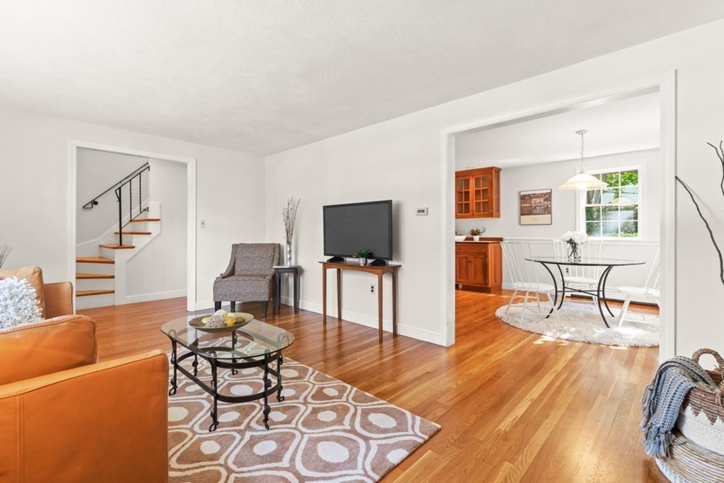 68 School Street Lexington, MA 02421 - Photo 5 of 24 a living room with furniture and a flat screen tv