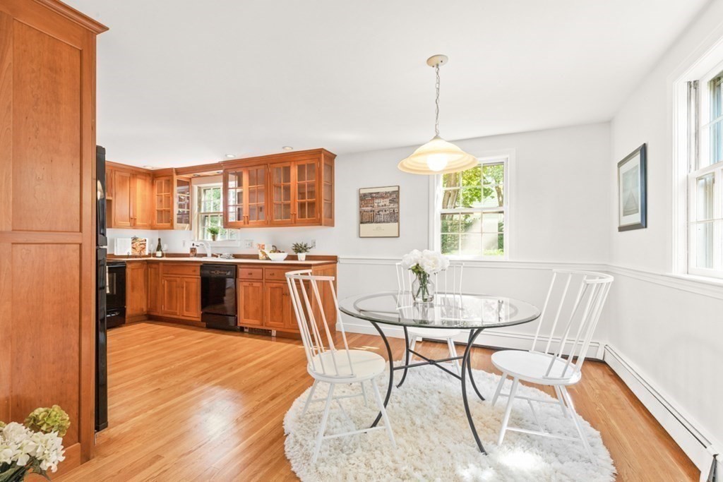 68 School Street Lexington, MA 02421 - Photo 6 of 24 a dining room with furniture a chandelier and wooden floor