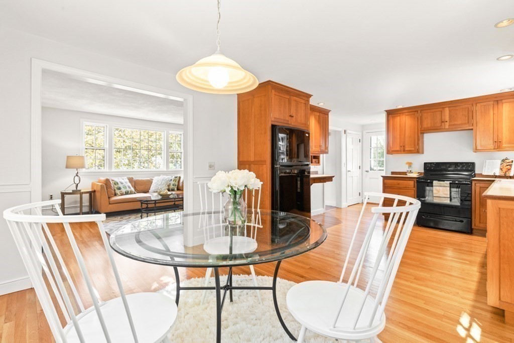 68 School Street Lexington, MA 02421 - Photo 7 of 24 a dining room with furniture a chandelier and wooden floor