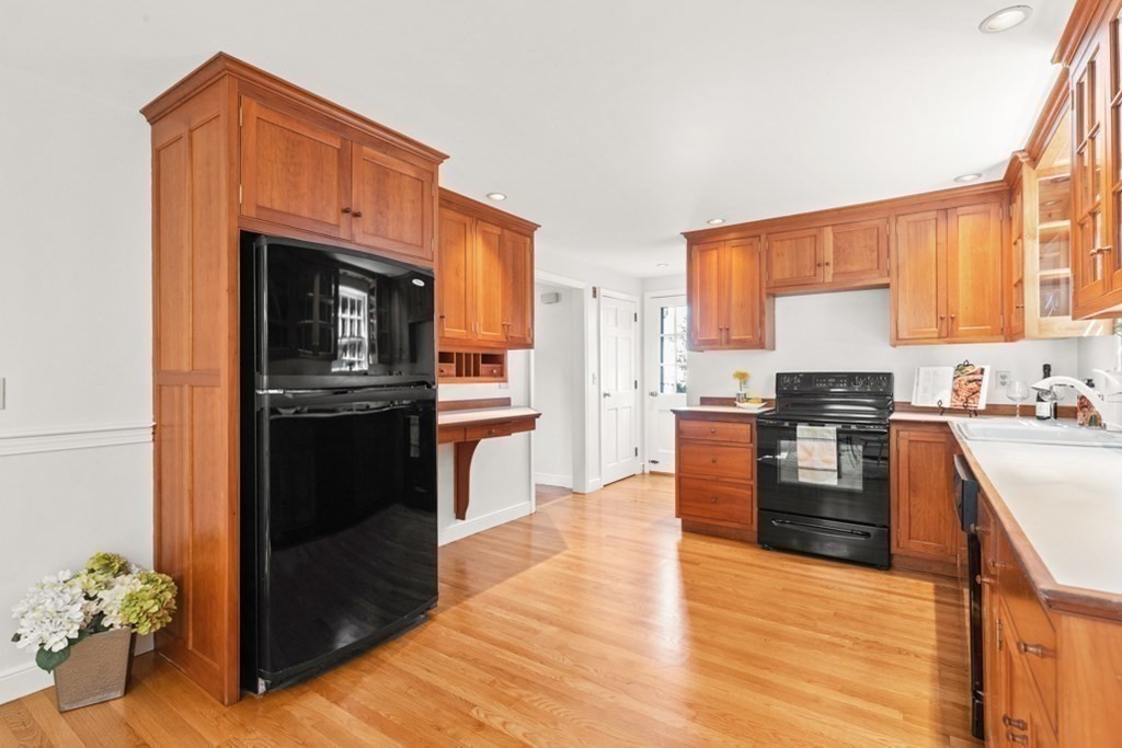 68 School Street Lexington, MA 02421 - Photo 8 of 24 a kitchen with granite countertop a stove top oven and sink