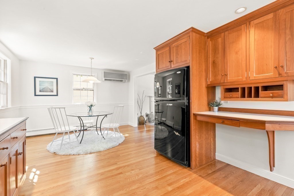 68 School Street Lexington, MA 02421 - Photo 10 of 24 a kitchen with stainless steel appliances granite countertop a refrigerator a stove and a sink with granite countertops