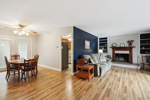 808 Westfield Drive Champaign, IL 61821 - Photo 11 of 31 a living room with furniture a fireplace and a table