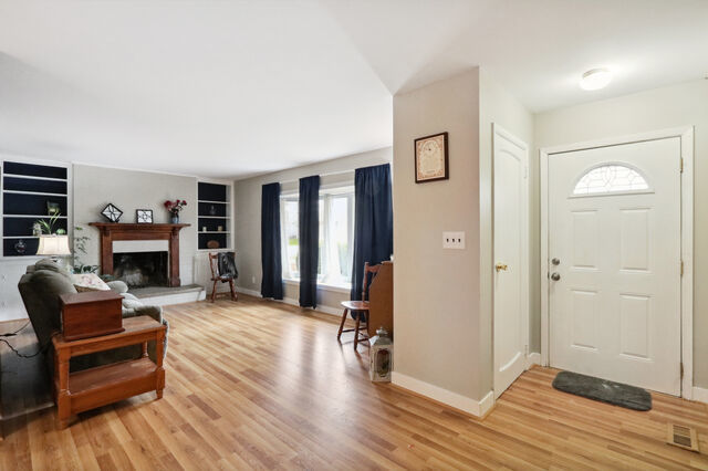 808 Westfield Drive Champaign, IL 61821 - Photo 12 of 31 a living room with furniture and a fireplace