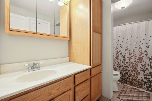 808 Westfield Drive Champaign, IL 61821 - Photo 15 of 31 a bathroom with a sink and a mirror