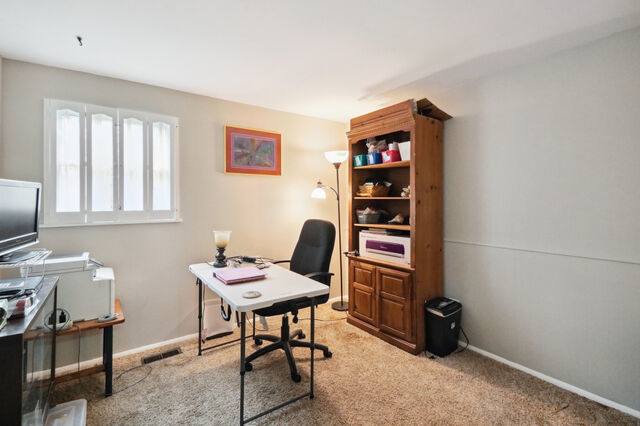 808 Westfield Drive Champaign, IL 61821 - Photo 17 of 31 a workspace with furniture and window