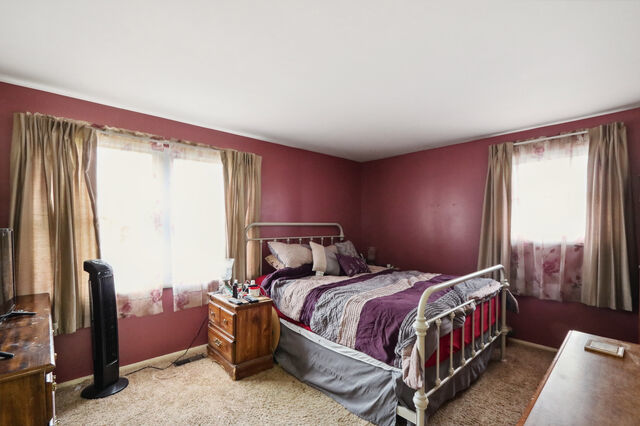 808 Westfield Drive Champaign, IL 61821 - Photo 21 of 31 a bedroom with a bed and a window