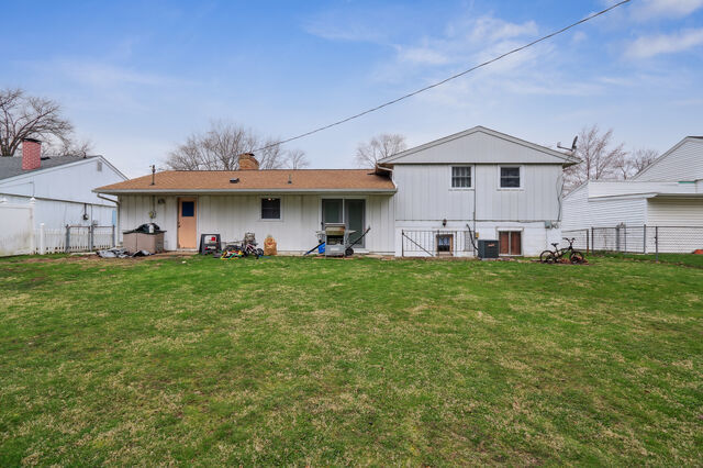 808 Westfield Drive Champaign, IL 61821 - Photo 24 of 31 a view of a white house with a big yard and large trees