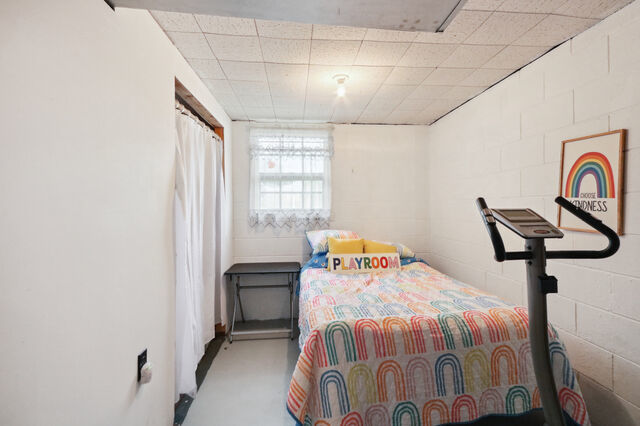 808 Westfield Drive Champaign, IL 61821 - Photo 28 of 31 a bedroom with a bed and a window