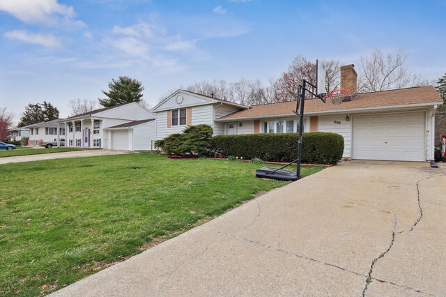 808 Westfield Drive Champaign, IL 61821 - Photo 3 of 31 a front view of a house with a yard and potted plants