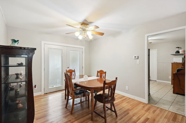 808 Westfield Drive Champaign, IL 61821 - Photo 8 of 31 a view of a dining room with furniture and wooden floor