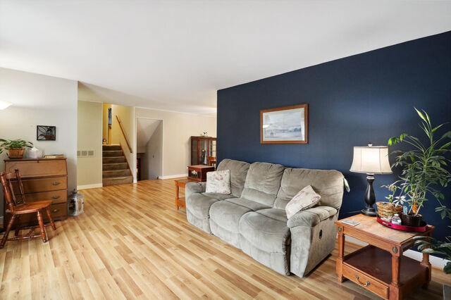 808 Westfield Drive Champaign, IL 61821 - Photo 10 of 31 a living room with furniture and a wooden floor