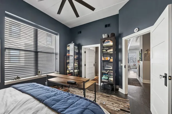 a bedroom with furniture and a window