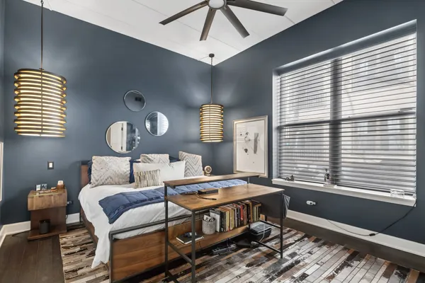 a bed room with a bed and a window