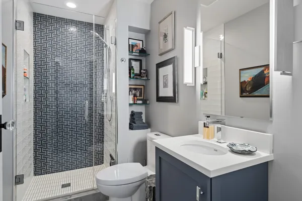 a bathroom with a sink toilet and shower