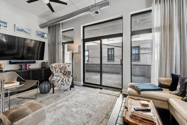 a room with furniture and a flat screen tv
