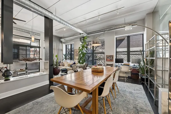 a view of a dining room with furniture window and outside view