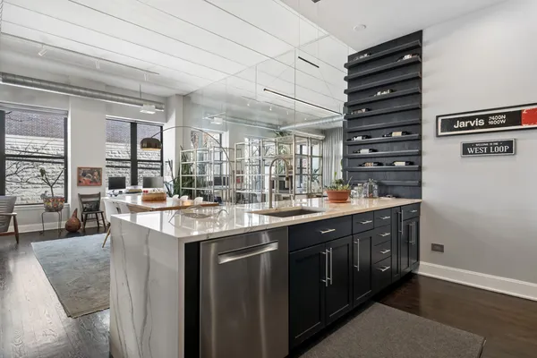 a kitchen with a sink and cabinets