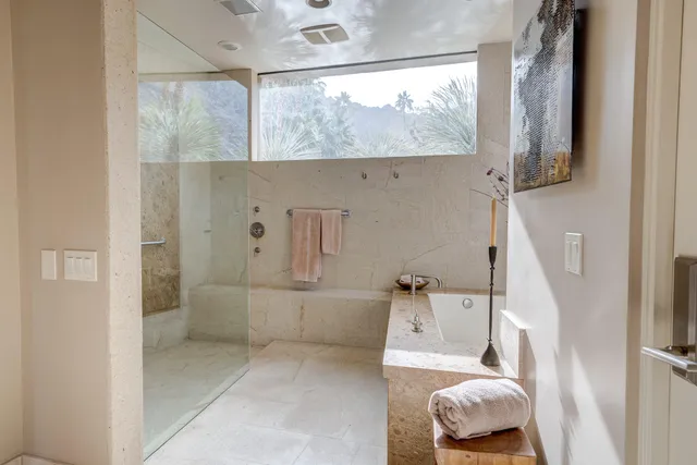 a bathroom with a bathtub and a window