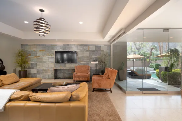 a living room with furniture and a flat screen tv