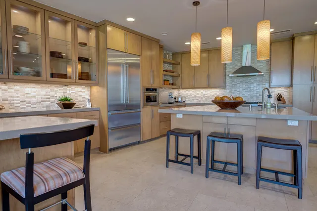 a kitchen with a sink cabinets and window