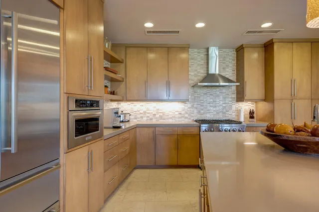 a kitchen with a refrigerator and a sink
