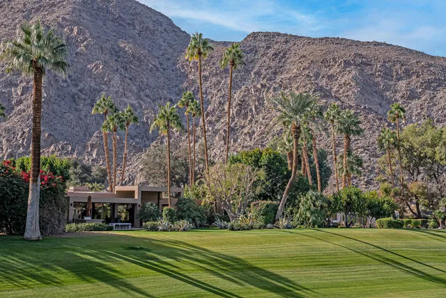 swimming pool view with a garden space