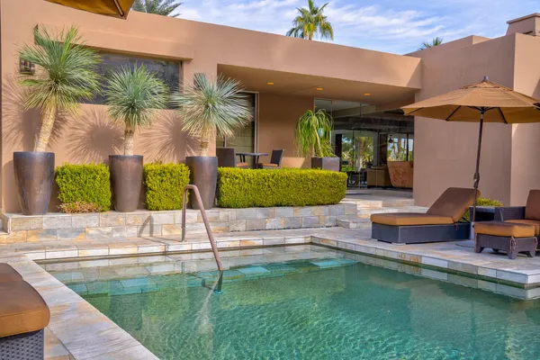 a view of a swimming pool with a patio