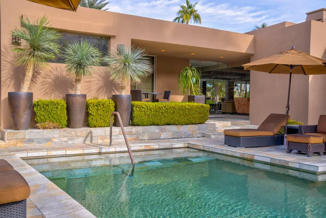 a view of a swimming pool with a patio