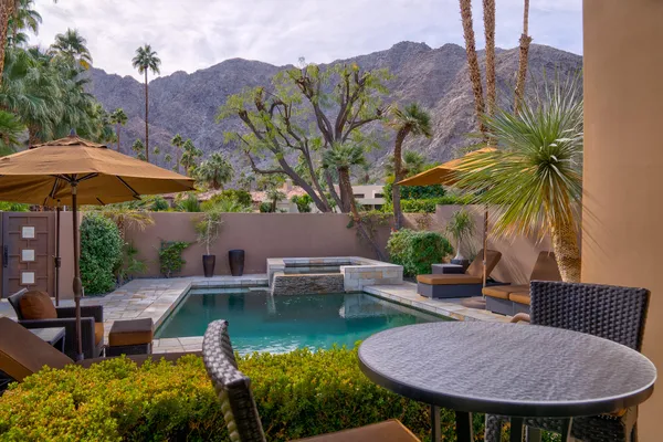 a view of a swimming pool with a patio