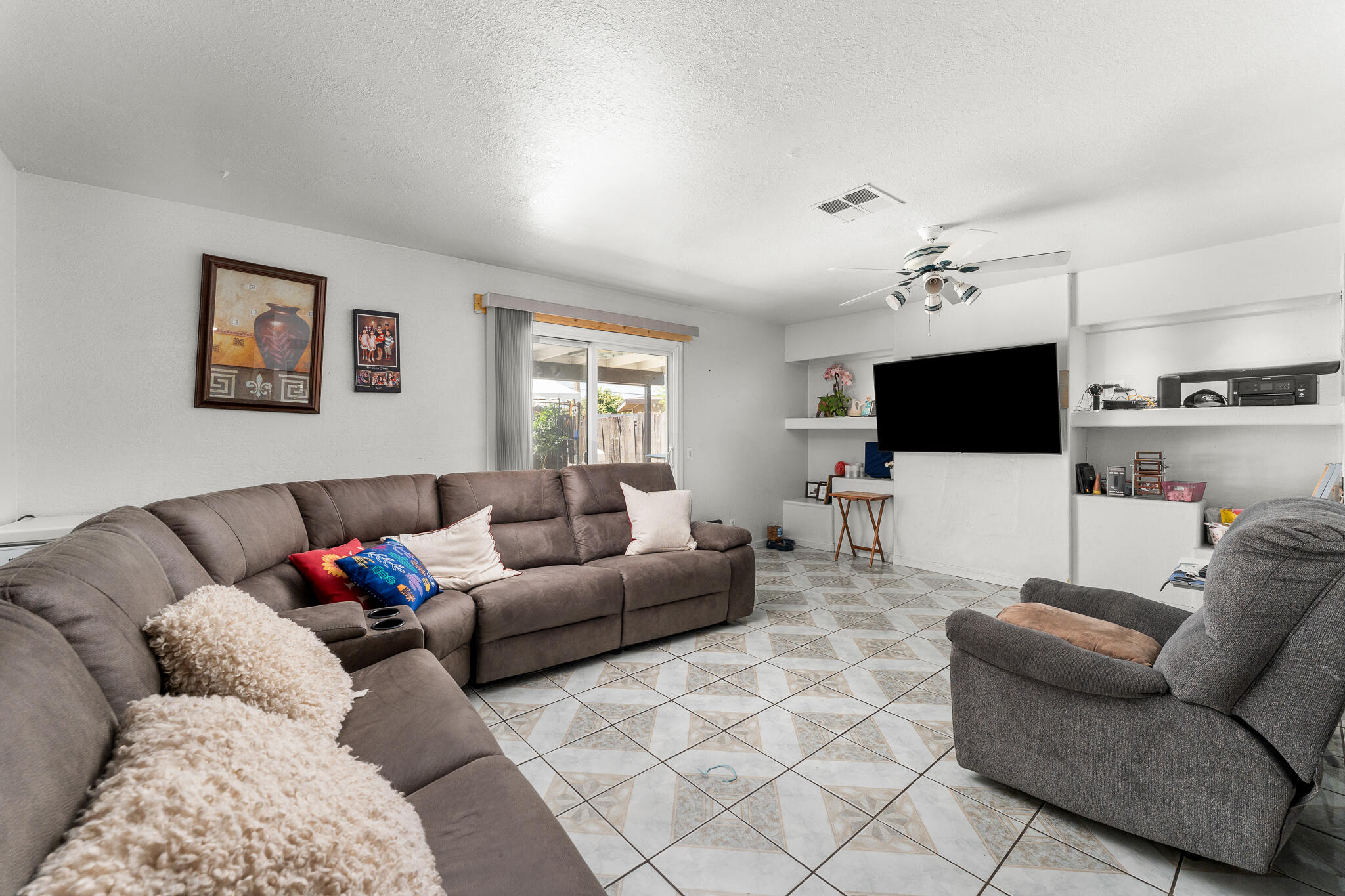 83307 Tourmaline Avenue Indio, CA 92201 - Photo 19 of 38 a living room with furniture and a flat screen tv