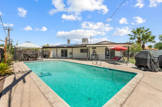 a front view of house with yard and patio