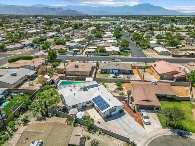 an aerial view of a house with a lake view