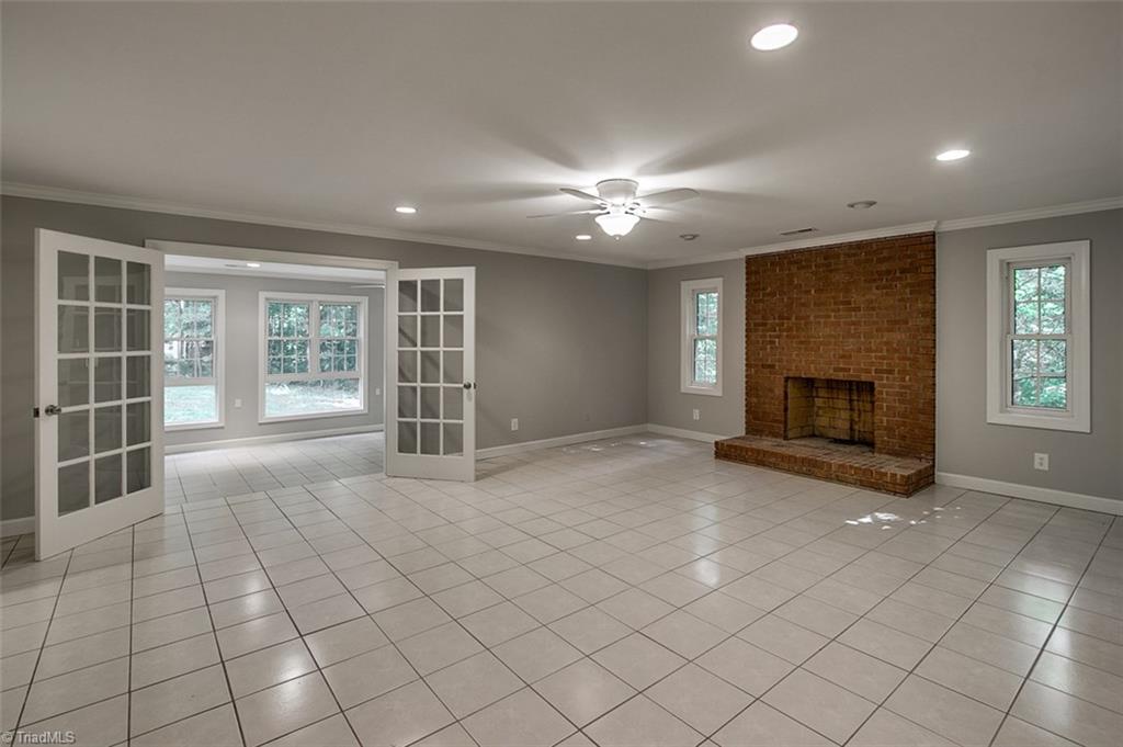 2601 Kilpatrick White Road Greensboro, NC 27406 - Photo 21 of 30 Lower level den with a brick fireplace