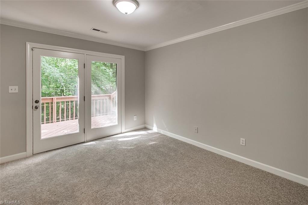 2601 Kilpatrick White Road Greensboro, NC 27406 - Photo 26 of 30 Bedroom has access to the rear deck.