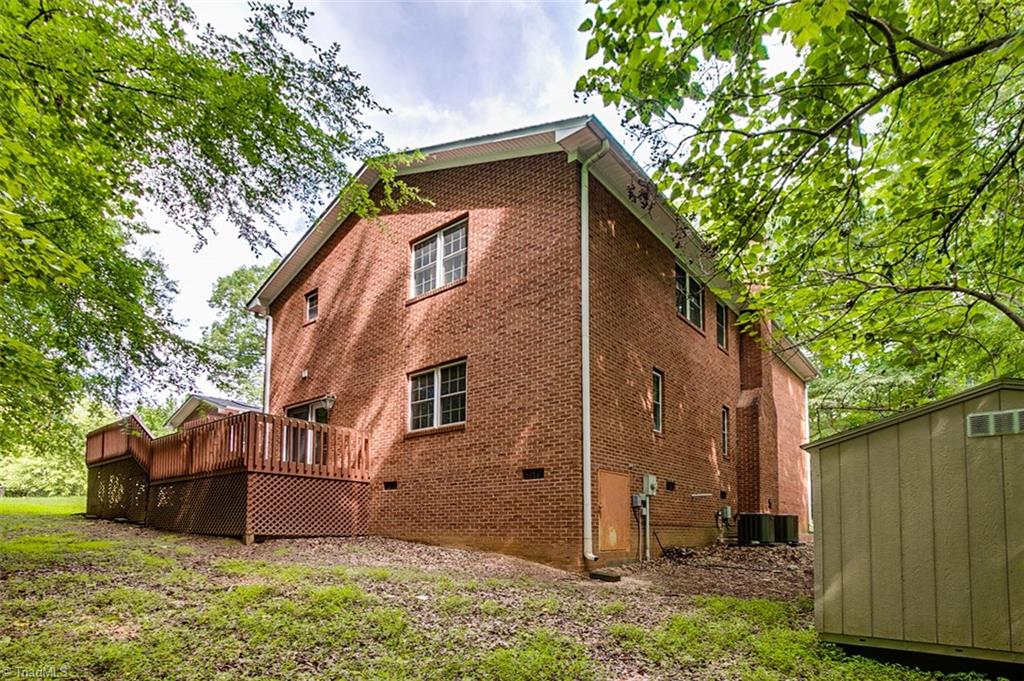 2601 Kilpatrick White Road Greensboro, NC 27406 - Photo 28 of 30 All brick, with private two level deck on 1.05 acres.