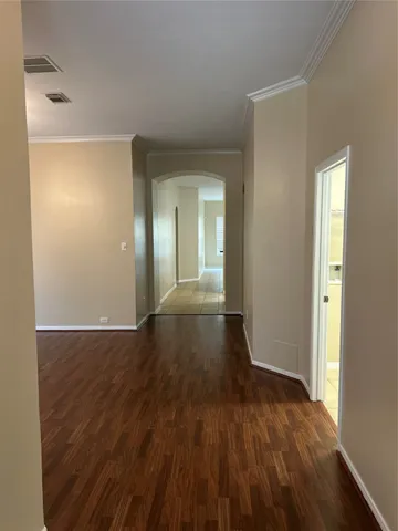 a view of hallway with wooden floor