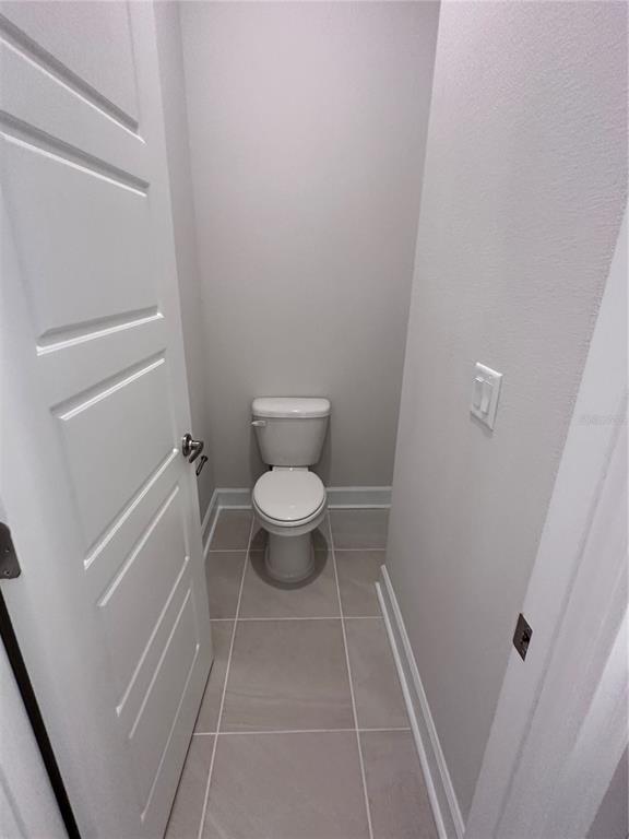 90 Rivertown Road Palm Coast, FL 32137 - Photo 22 of 60 a bathroom with a toilet and a shower