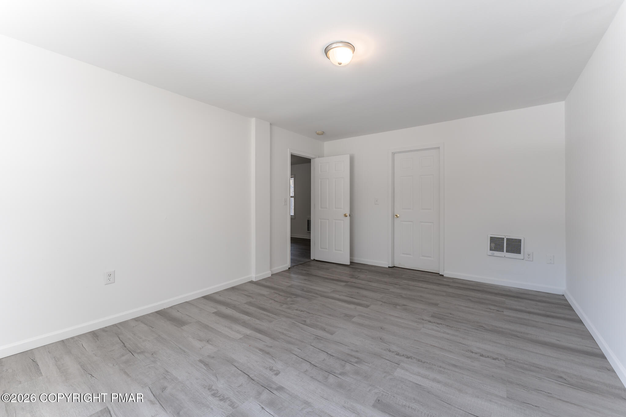 7624 Sawmill Road Tobyhanna, PA 18466 - Photo 19 of 55 a view of an empty room with wooden floor